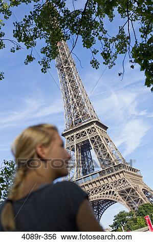Teenage girl in front of a tower, Eiffel Tower, Paris, Ile-de-France, France View Large Photo Image Stock Photograph - Teenage girl in front of a tower, Eiffel Tower, Paris, Ile-de-France, France. Fotosearch