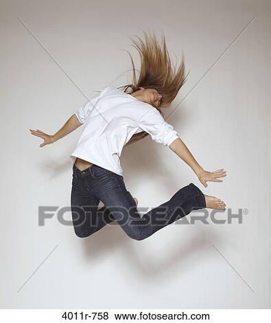 Stock Photo - Teenage girl jumping.. Fotosearch
