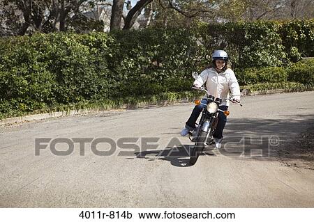 Teenage girl riding motorcycle View Large Photo Image Stock Image - Teenage girl riding motorcycle. Fotosearch