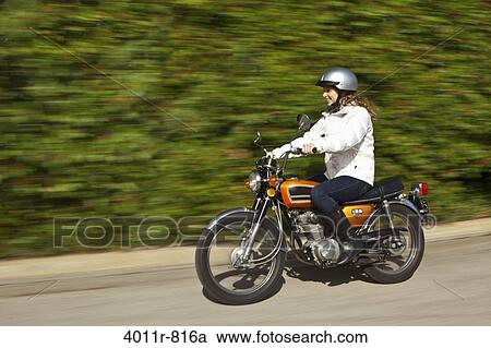 Teenage girl riding motorcycle View Large Photo Image Stock Image - Teenage girl riding motorcycle. Fotosearch