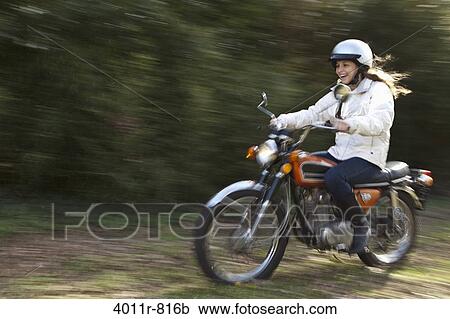 Teenage girl riding motorcycle View Large Photo Image Stock Image - Teenage girl riding motorcycle. Fotosearch