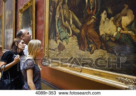 Teenage girl with her parents looking at a painting in a museum, Paris, Ile-de-France, France View Large Photo Image Stock Image - Teenage girl with her parents looking at a painting in a museum, Paris, Ile-de-France, France. Fotosearch