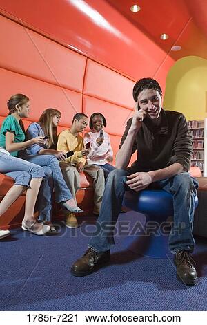 Teenagers with their cell phones View Large Photo Image Stock Image - Teenagers with their cell phones. Fotosearch