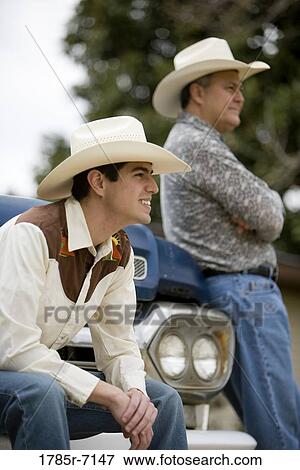 Tex-Mex father and son together leaning on truck View Large Photo Image Stock Photo - Tex-Mex father and son together leaning on truck. Fotosearch