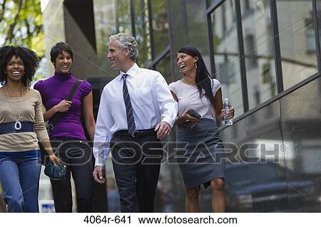 Three businesswomen walking outside office with businessman View Large Photo Image Stock Image - Three businesswomen walking outside office with businessman. Fotosearch