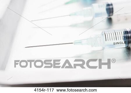 Three surgical needles in a row on tray View Large Photo Image Stock Photo - Three surgical needles in a row on tray. Fotosearch