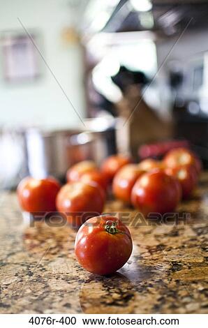 Tomatoes on kitchen counter View Large Photo Image Stock Image - Tomatoes on kitchen counter. Fotosearch