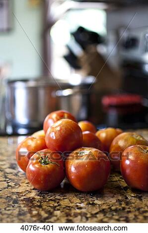Tomatoes on kitchen counter View Large Photo Image Stock Image - Tomatoes on kitchen counter. Fotosearch
