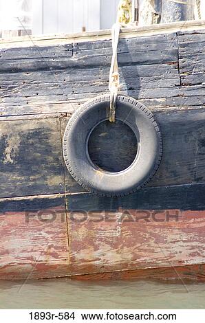 Picture - tyre buffer on a fishing trawler in Newport, Rhode Island. Fotosearch