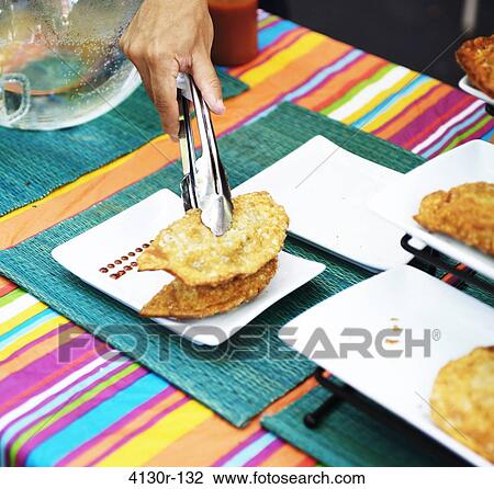 USA, New York State, New York City, Hester Street Market, La Sonrisa, Empanandas on colorful place mat View Large Photo Image Stock Image - USA, New York State, New York City, Hester Street Market, La Sonrisa, Empanandas on colorful place mat. Fotosearch