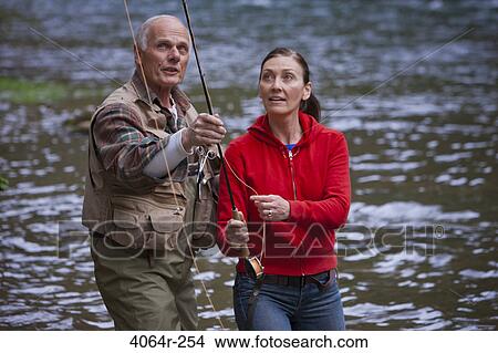 USA, Washington, Vancouver, Couple fishing in river View Large Photo Image Picture - USA, Washington, Vancouver, Couple fishing in river. Fotosearch