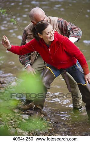 USA, Washington, Vancouver, Couple skipping stones on river View Large Photo Image Stock Image - USA, Washington, Vancouver, Couple skipping stones on river. Fotosearch