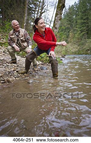 USA, Washington, Vancouver, Couple skipping stones on river View Large Photo Image Stock Image - USA, Washington, Vancouver, Couple skipping stones on river. Fotosearch