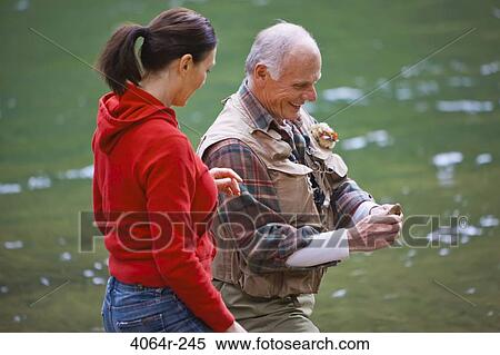 USA, Washington, Vancouver, Couple skipping stones on river View Large Photo Image Stock Photography - USA, Washington, Vancouver, Couple skipping stones on river. Fotosearch