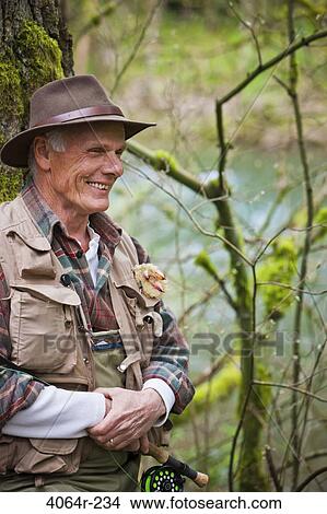 Picture - USA, Washington, Vancouver, Portrait of smiling senior fisherman. Fotosearch
