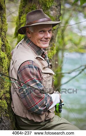 USA, Washington, Vancouver, Portrait of smiling senior fisherman View Large Photo Image Stock Photo - USA, Washington, Vancouver, Portrait of smiling senior fisherman. Fotosearch