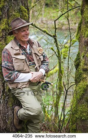 USA, Washington, Vancouver, Portrait of smiling senior fisherman View Large Photo Image Stock Photography - USA, Washington, Vancouver, Portrait of smiling senior fisherman. Fotosearch