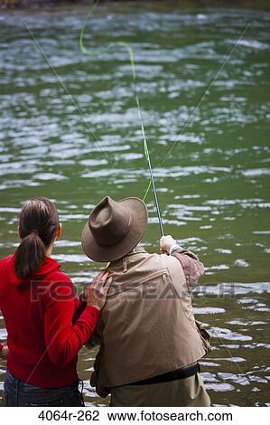 USA, Washington, Vancouver, Rear view of couple fishing in river View Large Photo Image Stock Image - USA, Washington, Vancouver, Rear view of couple fishing in river. Fotosearch