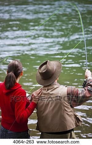 USA, Washington, Vancouver, Rear view of couple fishing in river View Large Photo Image Stock Image - USA, Washington, Vancouver, Rear view of couple fishing in river. Fotosearch