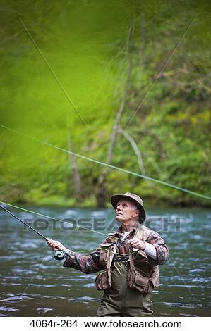 USA, Washington, Vancouver, Senior man fishing on river View Large Photo Image Picture - USA, Washington, Vancouver, Senior man fishing on river. Fotosearch