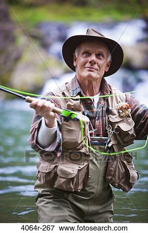 USA, Washington, Vancouver, Senior man fishing on river View Large Photo Image Stock Photo - USA, Washington, Vancouver, Senior man fishing on river. Fotosearch