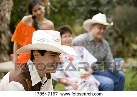 View of a Mexican-American family sitting together View Large Photo Image Stock Photo - View of a Mexican-American family sitting together. Fotosearch