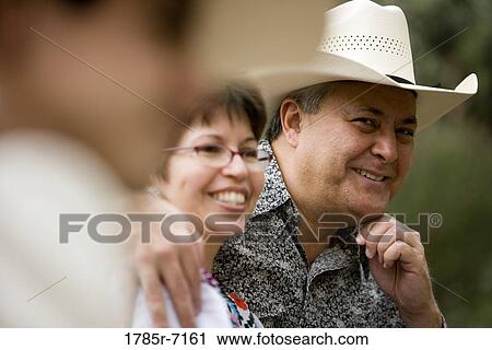 View of a smiling mature Tex-Mex couple View Large Photo Image Stock Image - View of a smiling mature Tex-Mex couple. Fotosearch