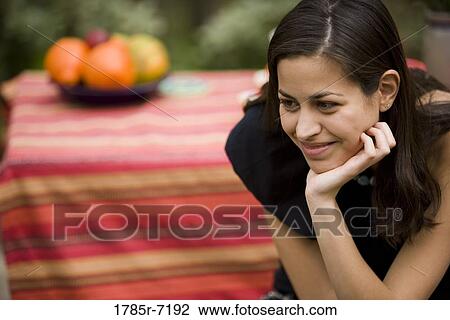 View of a smiling young woman View Large Photo Image Stock Image - View of a smiling young woman. Fotosearch