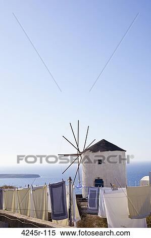 Windmill and laundry on an island, Santorini, Greece View Large Photo Image Stock Photography - Windmill and laundry on an island, Santorini, Greece. Fotosearch