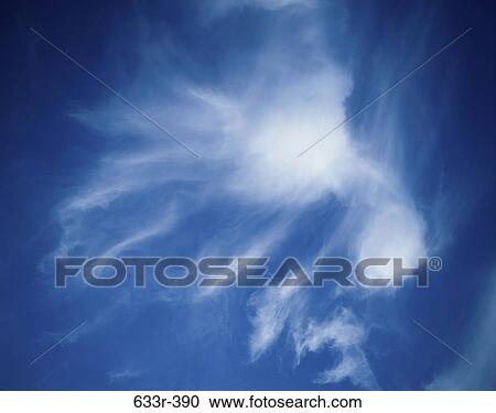 Wispy cloud in a blue sky View Large Photo Image Stock Image - Wispy cloud in a blue sky. Fotosearch