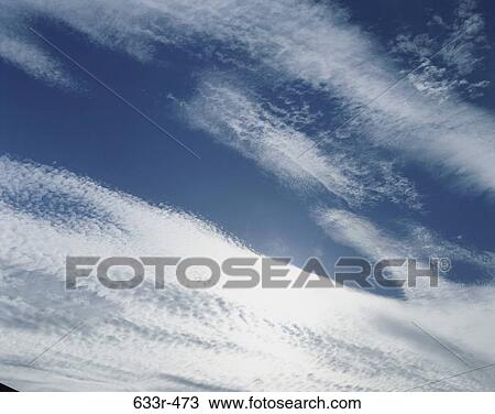 Wispy clouds in the sky View Large Photo Image Stock Image - Wispy clouds in the sky. Fotosearch