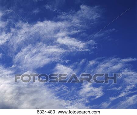 Wispy clouds in the sky View Large Photo Image Stock Image - Wispy clouds in the sky. Fotosearch