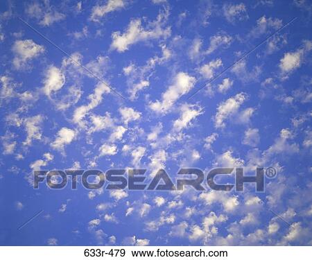 Stock Photo - Wispy clouds in the sky. Fotosearch