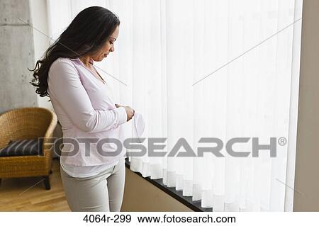 Woman getting dressed in morning View Large Photo Image Stock Photo - Woman getting dressed in morning. Fotosearch