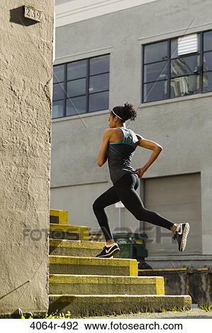 Woman jogging up steps View Large Photo Image Stock Image - Woman jogging up steps. Fotosearch