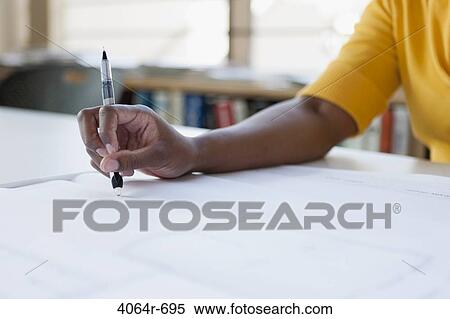 Woman working on plans, close-up View Large Photo Image Stock Photography - Woman working on plans, close-up. Fotosearch