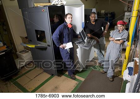 Workers being trained to use a piece of machinery with computer controls View Large Photo Image Stock Image - Workers being trained to use a piece of machinery with computer controls. Fotosearch