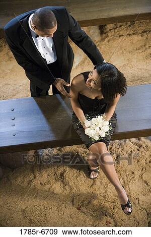 Young couple in formal attire View Large Photo Image Stock Photo - Young couple in formal attire. Fotosearch