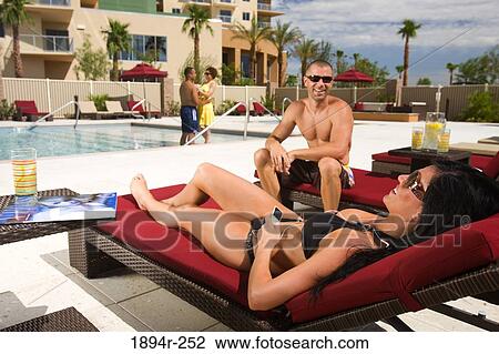 Young couples enjoying at a tourist resort View Large Photo Image Stock Image - Young couples enjoying at a tourist resort. Fotosearch