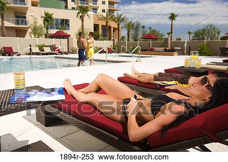 Young couples enjoying at a tourist resort View Large Photo Image Stock Image - Young couples enjoying at a tourist resort. Fotosearch