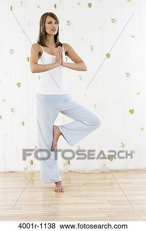 Young woman doing yoga View Large Photo Image Stock Photo - Young woman doing yoga. Fotosearch