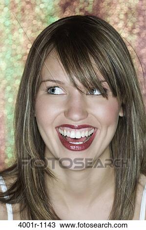 Young woman wearing lipstick, smiling View Large Photo Image Stock Image - Young woman wearing lipstick, smiling. Fotosearch