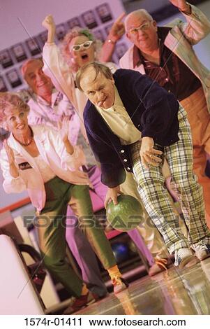 Stock Image - Bowling team in a bowling alley. Fotosearch
