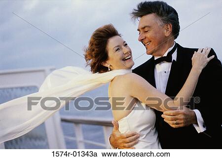 Couple holding each other on a ship View Large Photo Image Stock Image - Couple holding each other on a ship. Fotosearch