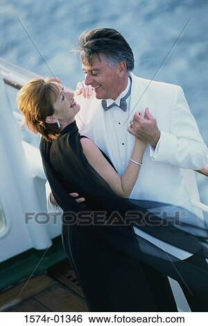 Stock Photograph - Couple holding each other on a ship. Fotosearch