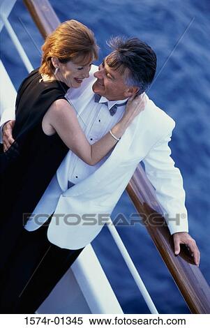 Stock Photography - Couple holding each other on a ship. Fotosearch