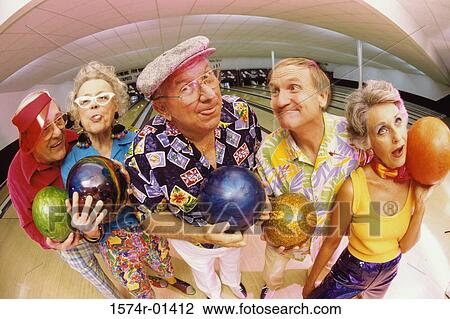 Stock Image - Portrait of a bowling team in a bowling alley. Fotosearch