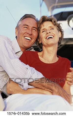Stock Image - Portrait of a couple holding each other. Fotosearch