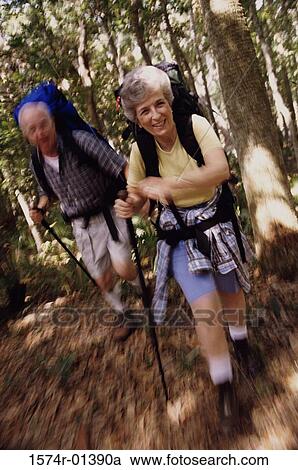 Portrait of a senior couple hiking in the woods View Large Photo Image Stock Image - Portrait of a senior couple hiking in the woods. Fotosearch