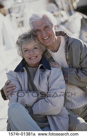 Portrait of a senior couple holding each other View Large Photo Image Stock Image - Portrait of a senior couple holding each other. Fotosearch